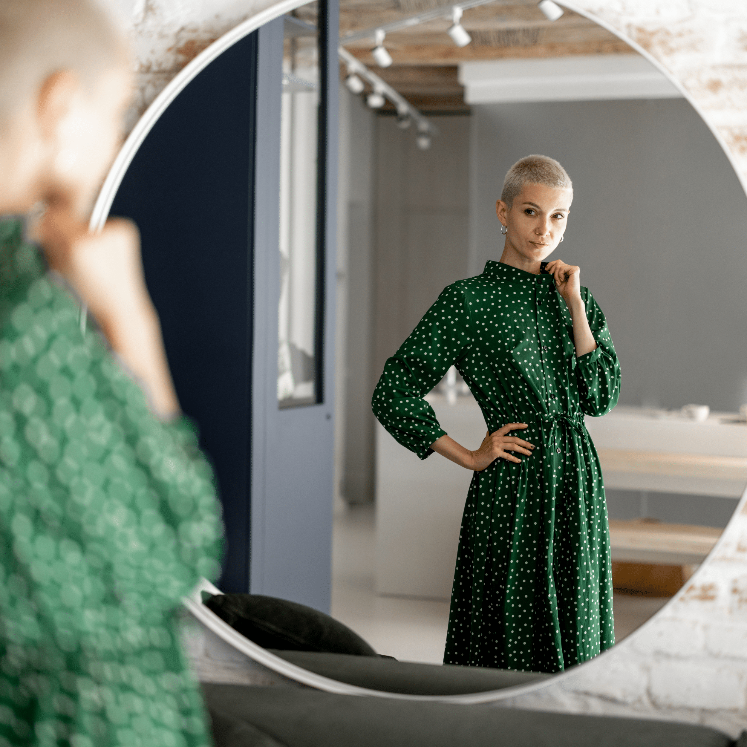 Woman looking at herself in the mirror.