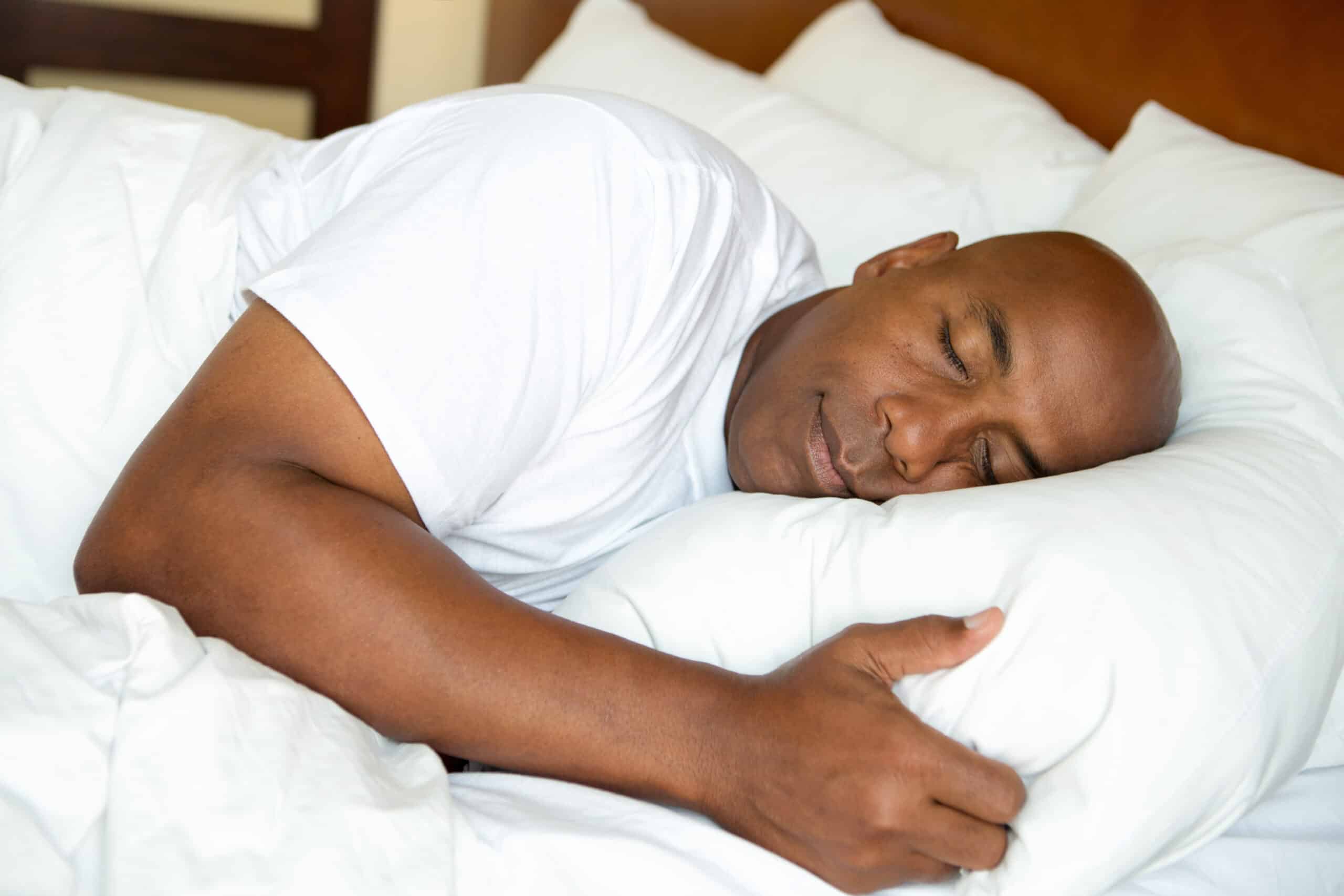Man sleeps soundly in bed