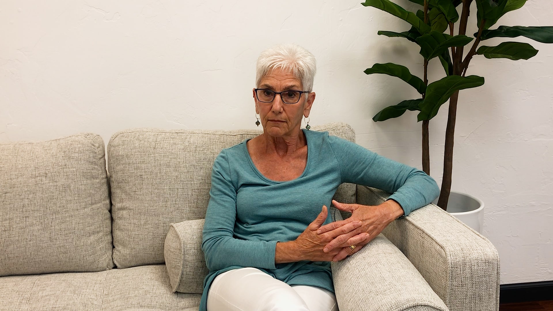 Psychologist Roz Kalb sitting on couch