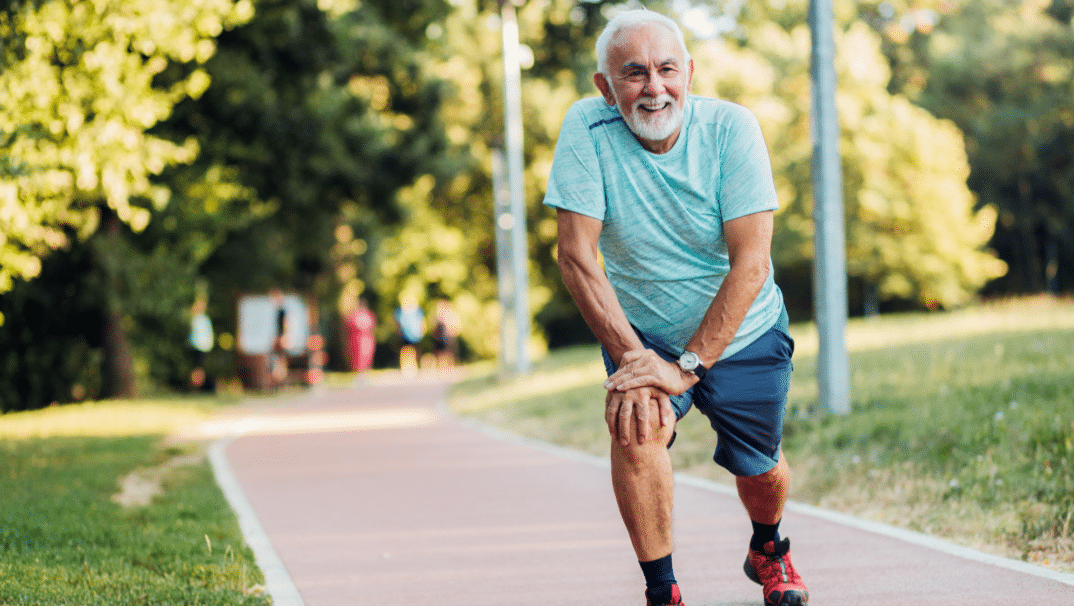 Older man outside exercising