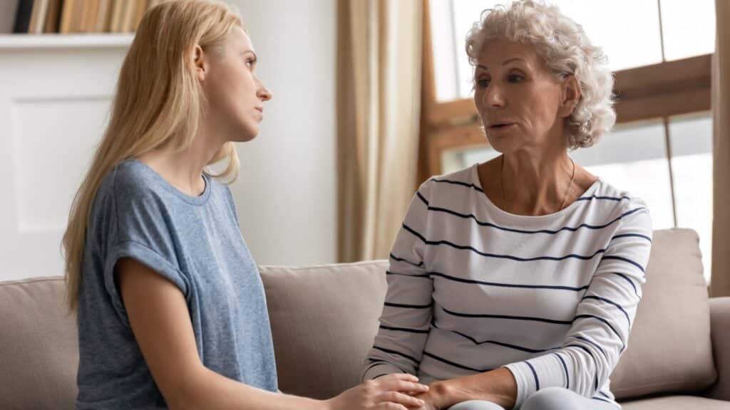 Adult Mother and Daughter talking on the couch