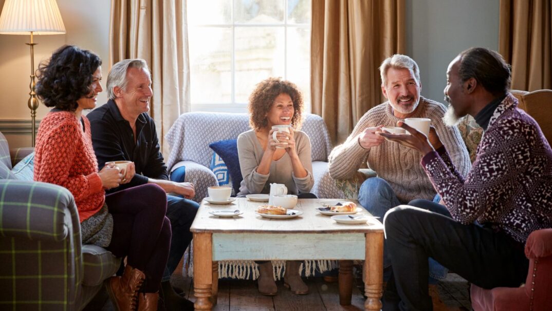 Group of friends drinking coffee and talking