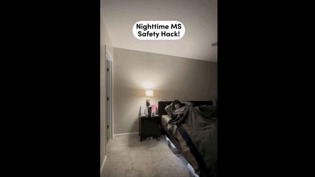 Emily Reilly putting on her eyemask in bed. The text on screen says: Nighttime MS Safety Hack