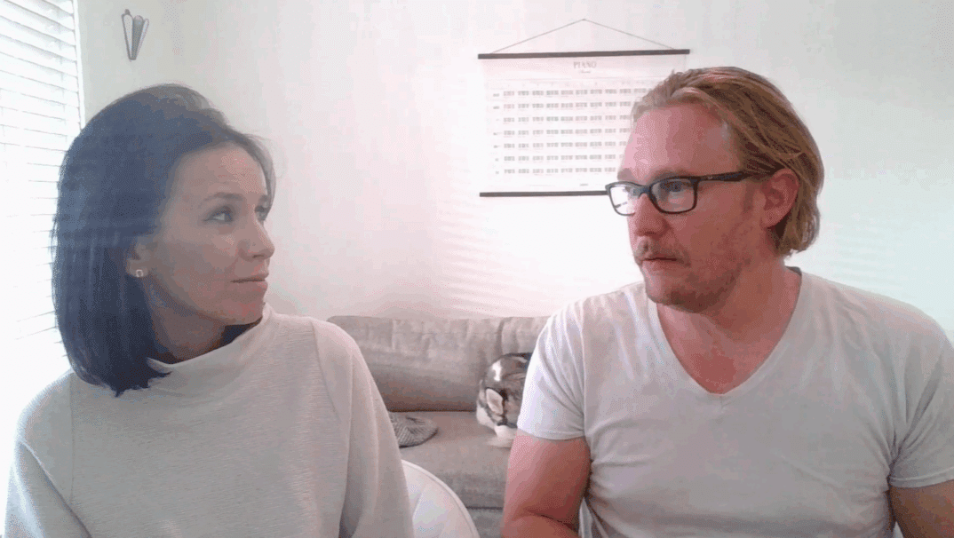 Julie and Adam Stamm sitting together.