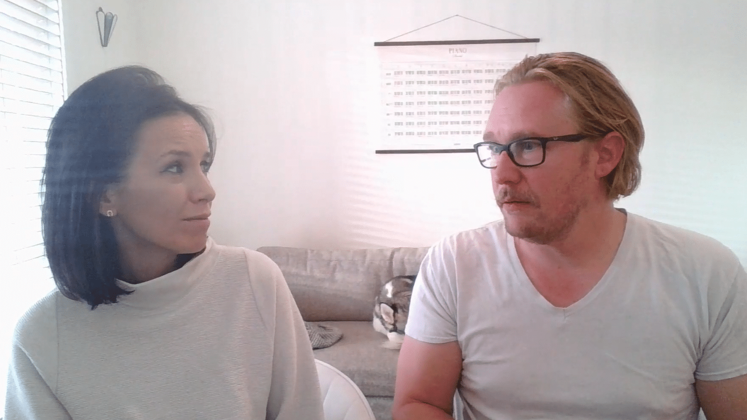 Julie and Adam Stamm sitting together.