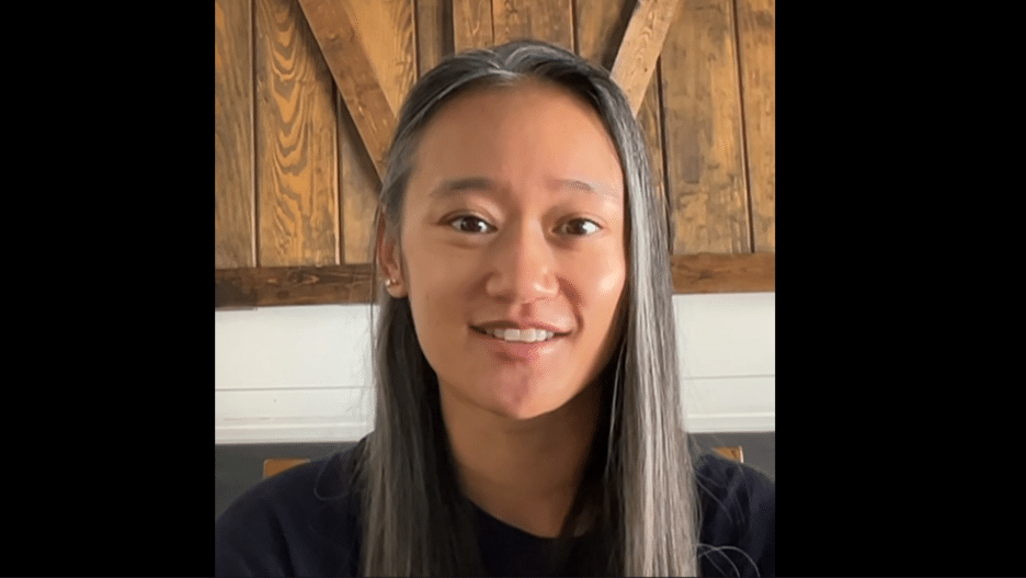 Anjelica sitting in her office.