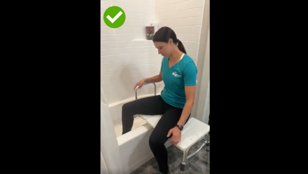 Mandy demonstrating the correct way to use a tub transfer bench.